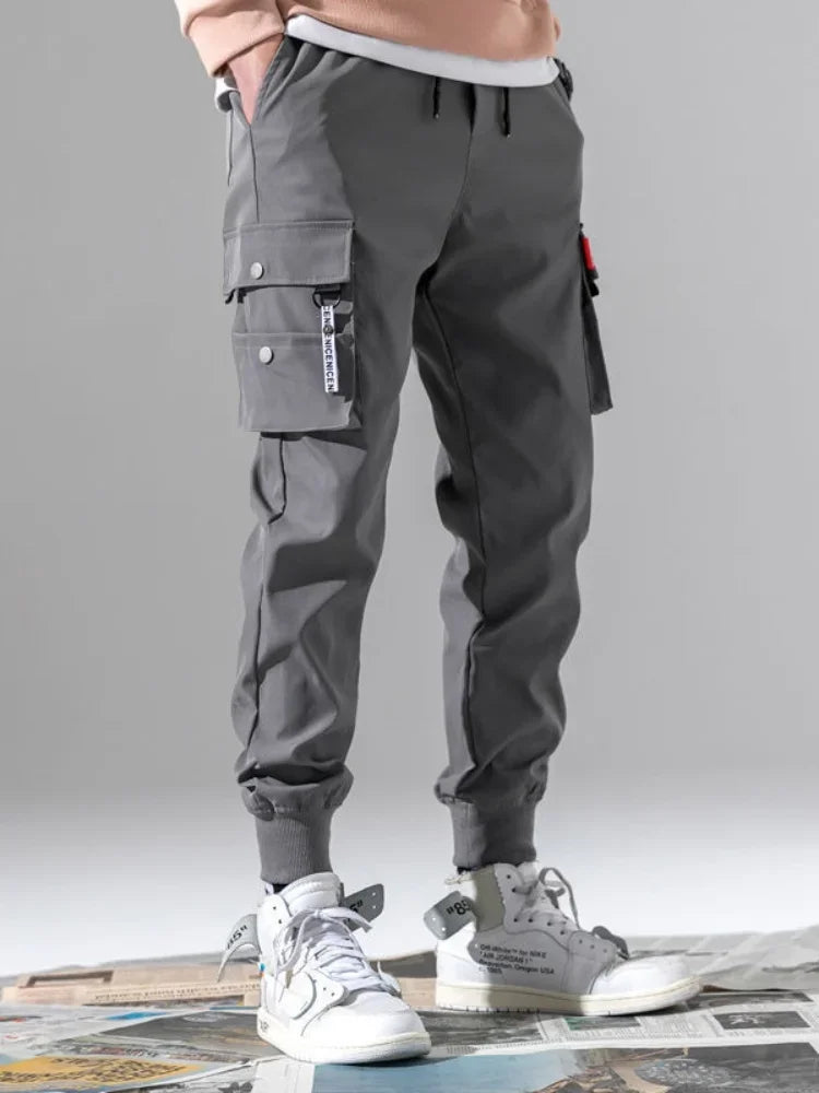 2025 nouveau pantalon de couleur unie à la mode multi-poche à rabat pantalon Cargo pour hommes pantalon d'extérieur ample décontracté pantalon de travail masculin surdimensionné Camara Shopping 2025 nouveau pantalon de couleur unie à la mode multi-poche à rabat pantalon Cargo pour hommes pantalon d'extérieur ample décontracté pantalon de travail masculin surdimensionné