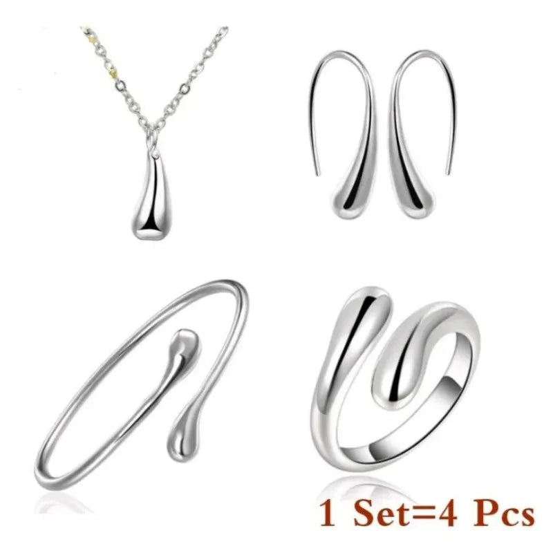 Mode S925 argent aiguille boucles d'oreilles bague Bracelet ensemble Simple personnalité femmes goutte d'eau quatre pièces ensemble de bijoux pour les femmes cadeau Camara Shopping Mode S925 argent aiguille boucles d'oreilles bague Bracelet ensemble Simple personnalité femmes goutte d'eau quatre pièces ensemble de bijoux pour les femmes cadeau