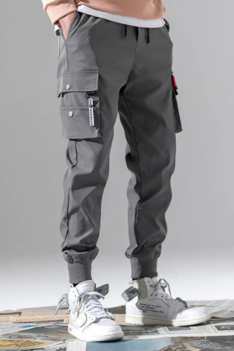 2025 nouveau pantalon de couleur unie à la mode multi-poche à rabat pantalon Cargo pour hommes pantalon d'extérieur ample décontracté pantalon de travail masculin surdimensionné Camara Shopping 2025 nouveau pantalon de couleur unie à la mode multi-poche à rabat pantalon Cargo pour hommes pantalon d'extérieur ample décontracté pantalon de travail masculin surdimensionné
