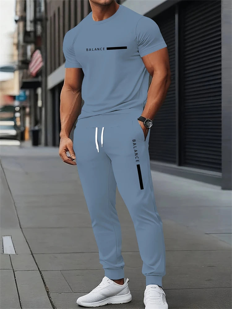 Ensemble deux pièces pour hommes, lettres imprimées, décontracté, col rond, manches courtes, cordon de serrage, pantalon Long, grande taille, tenue ample, nouvelle collection Camara Shopping Ensemble deux pièces pour hommes, lettres imprimées, décontracté, col rond, manches courtes, cordon de serrage, pantalon Long, grande taille, tenue ample, nouvelle collection