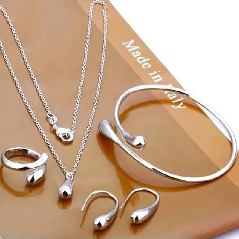 Mode S925 argent aiguille boucles d'oreilles bague Bracelet ensemble Simple personnalité femmes goutte d'eau quatre pièces ensemble de bijoux pour les femmes cadeau Camara Shopping Mode S925 argent aiguille boucles d'oreilles bague Bracelet ensemble Simple personnalité femmes goutte d'eau quatre pièces ensemble de bijoux pour les femmes cadeau